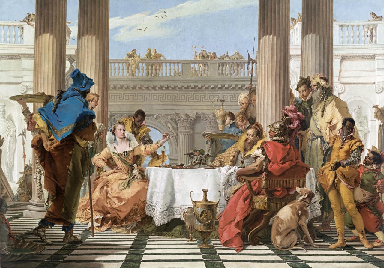 Giambattista Tiepolo’s, The Banquet of Cleopatra at the National Gallery of Victoria involves costumed men and women sitting around a table in a columned, grand open courtyard.  The seated Cleopatra holds her pearl earing out towards the men on the right.  A greyhound sits in the foreground beside these men. A man with a vivid blue cloak (foreground/left) watches with his back to the audience 